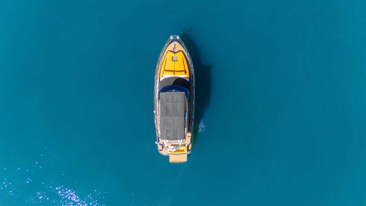 Aerial view of a Baltra 45 sport yacht on turquoise water, a private yacht rental from Nuevo Vallarta in Puerto Vallarta's Banderas Bay